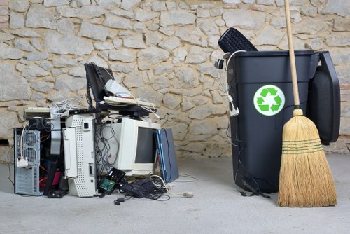 Workers sorting commercial recycling at a depot